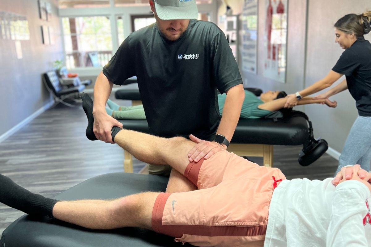 stretching a man's leg