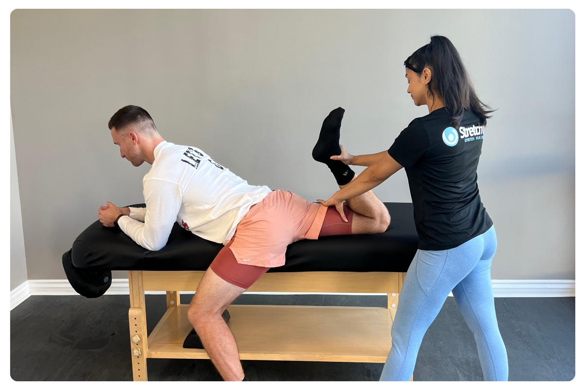 tech stretching back of leg