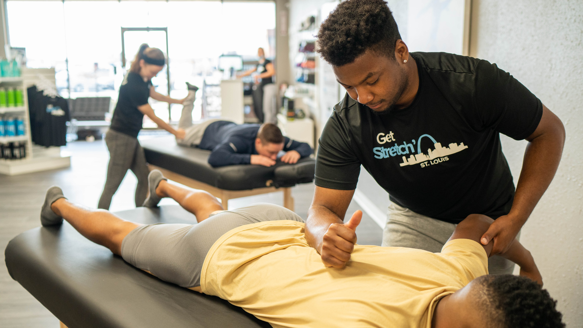 working on lower back to relieve pain