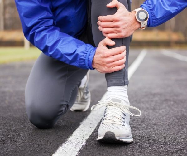 runner holding leg