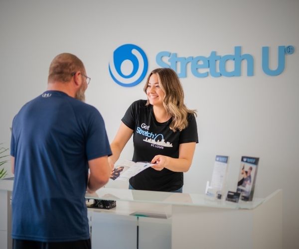 stretch tech with a customer in a stretch u studio
