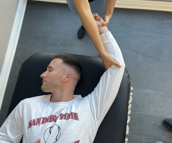 a man getting an upper body stretch