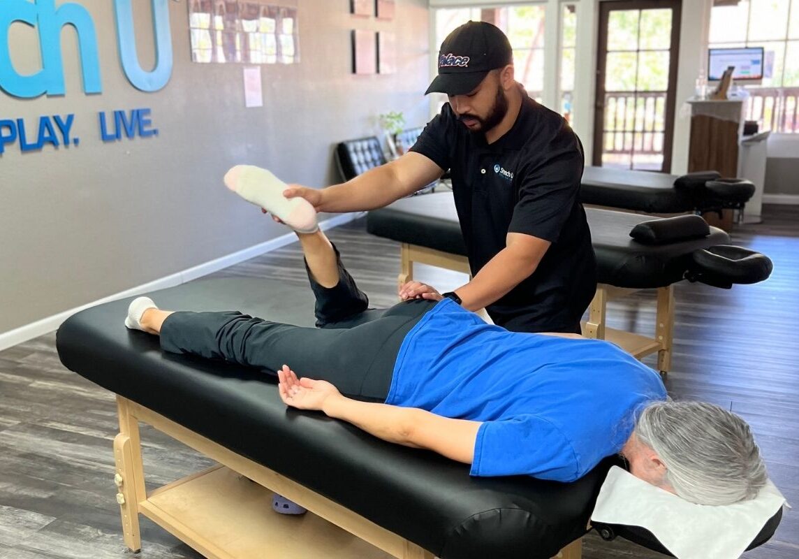 stretching a woman's leg