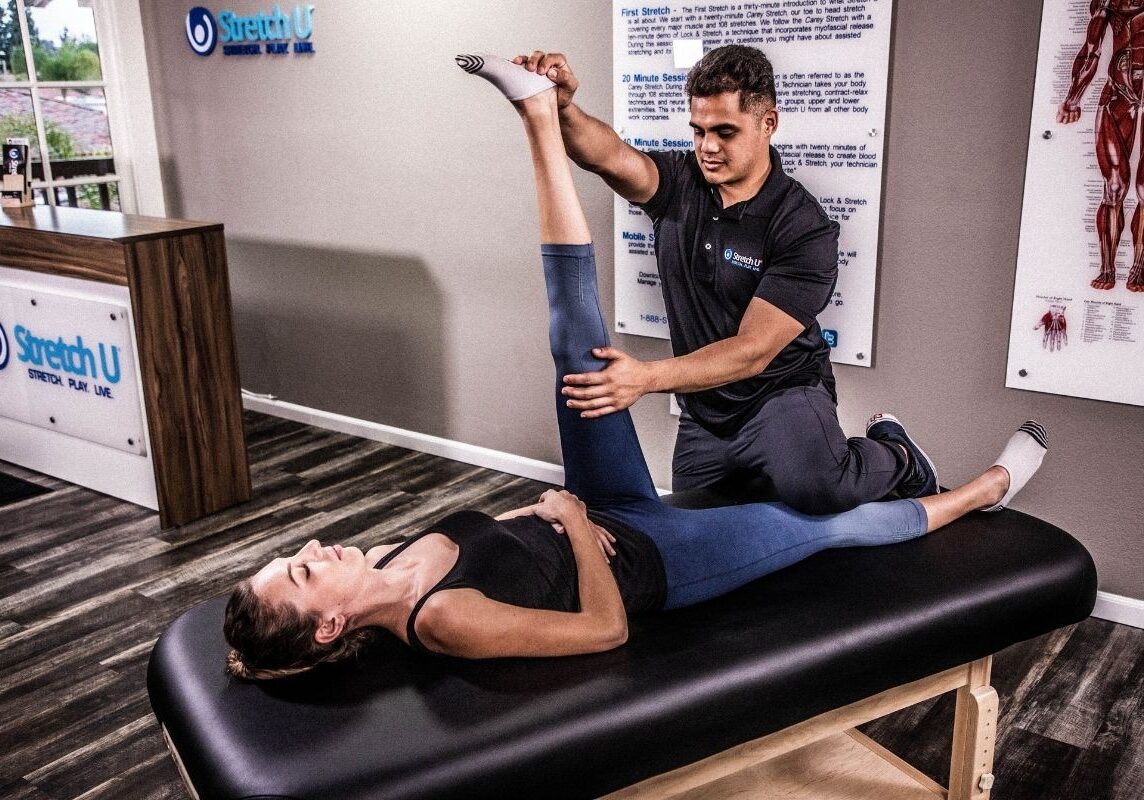 stretching a woman's leg